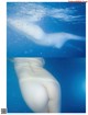 A picture of a naked woman swimming in the water.